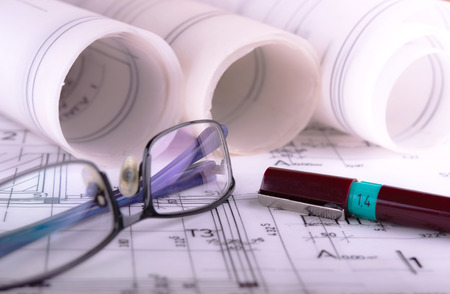 Architecture rolls architectural techical plans project architect blueprintsの写真素材