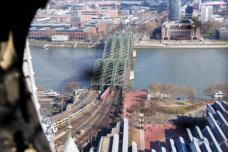 Panoramic aerial view over Cologne historic city center, downtown, with colorful historical buildings, gothic cathedral towers, the Rhine river and modern bridge against beautiful sunny spring sky.の写真素材