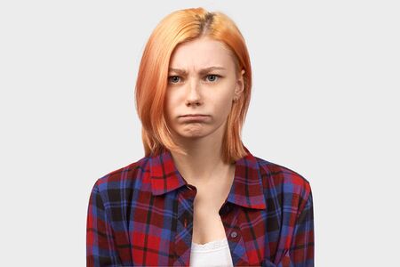 irritated woman with anger looks at camera, angerの写真素材