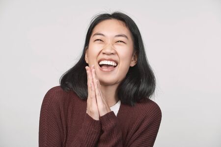 Thankful Girl keeps hands, expresses manners heartの写真素材