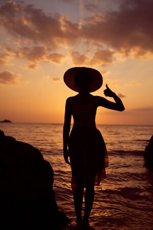 Contrast silhouette of young slender womanの写真素材