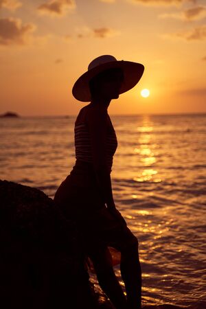 Contrast silhouette of young slender womanの写真素材