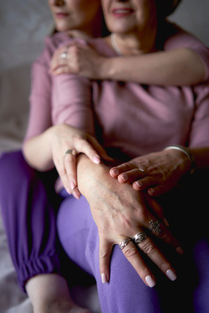 the  portrait of old mother and middle-aged daughter at homeの写真素材