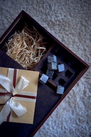 a  gift certificate on a wooden whiskey box
