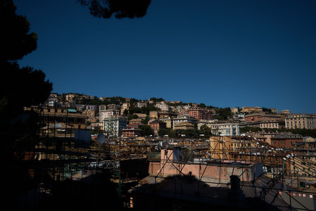 the roofs of houses in Genoa with a view of the sea on a sunny dayの写真素材