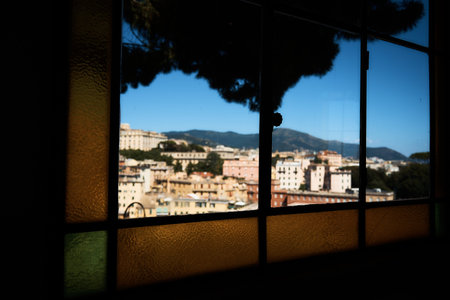 the view of Genoa through the stained glass window of the funicular