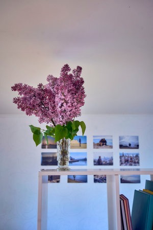 bouquet of lilacs in a crystal vase in the interior