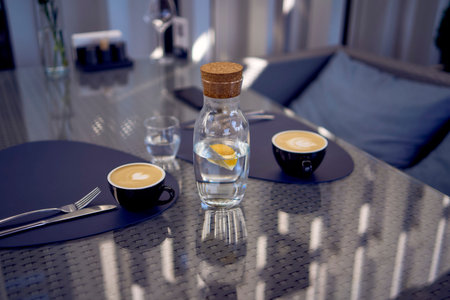 cups of coffee, latte and cappuccino on a table in a cafe