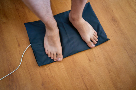 the man put his feet on the grounding wedge, self-soothing, relaxation