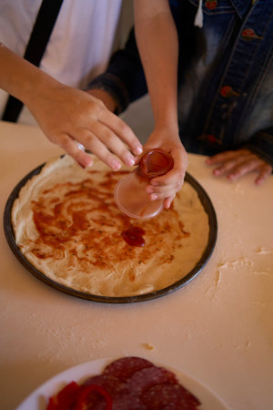 workshop for children on cooking pizza in an old wood-fired ovenの写真素材