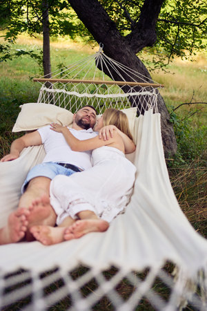 loving couple in hammock, millennialsの写真素材