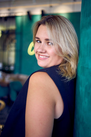 middle-aged plus size woman in old money style clothes in a fancy restaurant