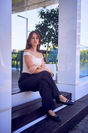 portrait of  16-year-old teenage girl in old money style clothes in  fancy restaurantの写真素材