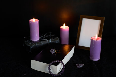 funeral, photo frame, candles, urn for ashes, holy bible and jewelry with precious stonesの写真素材