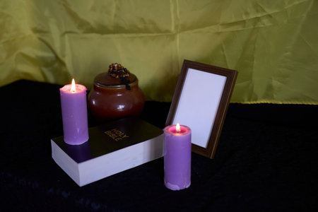 funeral of Ukrainian , photo frame, candles, marble urn for ashes, holy bible and spiritual bracelet...