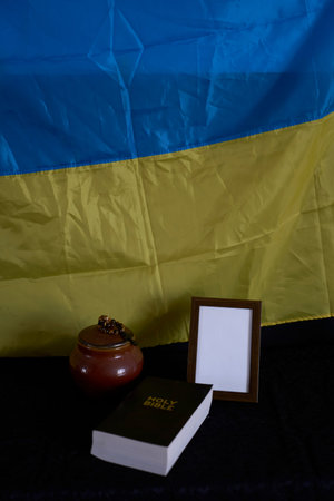 funeral of Ukrainian , photo frame, candles, marble urn for ashes, holy bible and spiritual bracelet...