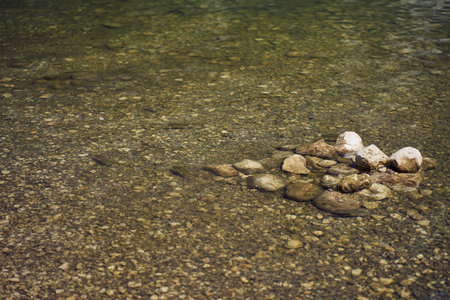 Close up video of crystal clear turquoise water on the shallows of the Lake Bohinjの写真素材
