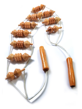 Traditional handheld wooden massager tool on whiteの写真素材