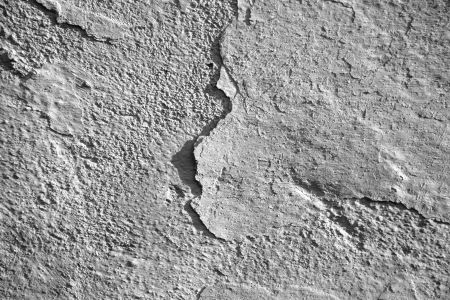Old white textured wall as a background の写真素材