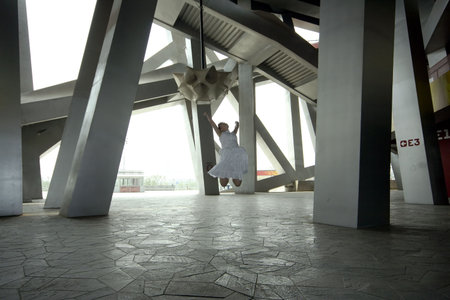 jumping white girl in modern urban architecture