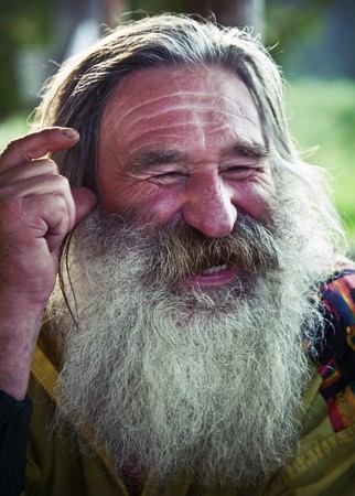 portrait of  laughing old man with gray beardの写真素材