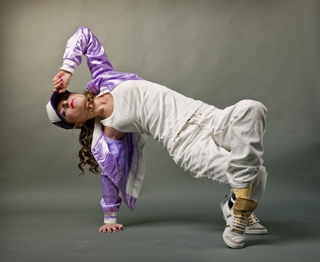 Young, beautiful  girl dancing hip-hop studio seriesの写真素材