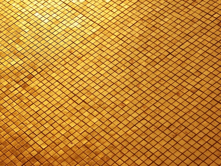 gold mosaic texture close-up photoの写真素材