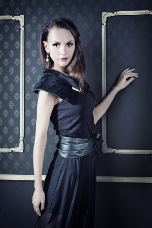 beautiful woman in elegant dress posing in  vintage  interiorの写真素材