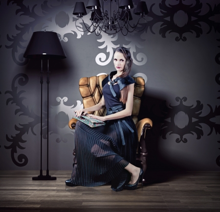 beautiful woman in luxury armchair  photo compilation の写真素材