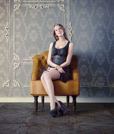 beautiful woman in luxury armchair の写真素材