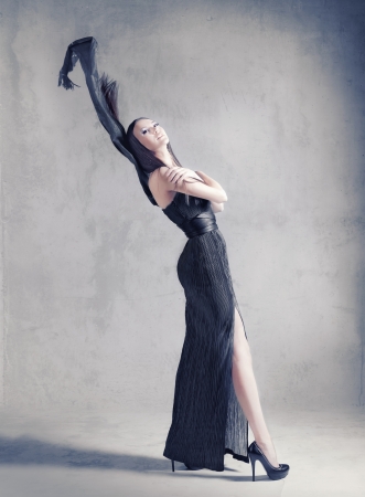 figure of a beautiful woman with a flying scarfの写真素材