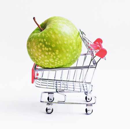 the Shopping cart with big appleの写真素材