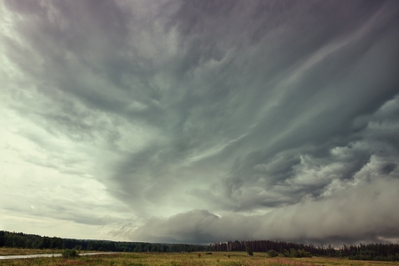 storm Clouds over field  Siberia Russiaの写真素材