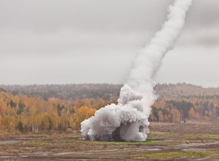 falling smoke trail in the sky and the explosion on the ground