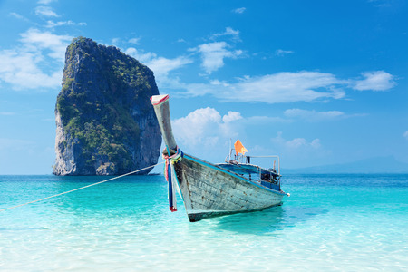 Fishing thai boat and landmark at Poda island, Krabi Province, Andaman Sea, South of Thailand の写真素材