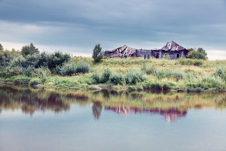 abandoned house near the waterの写真素材