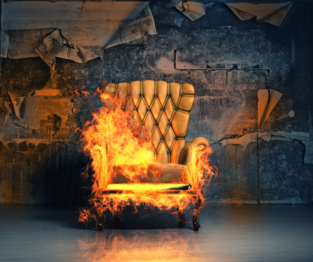 burning armchair in the grunge interior. 3D illustration creative conceptの写真素材