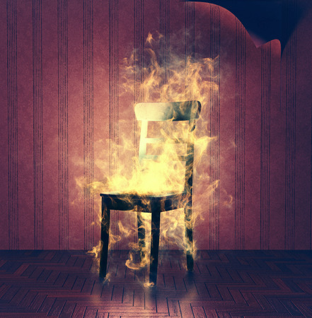 The burning chair in old vintage interior.3d illustration. Creative conceptの写真素材