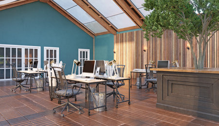 A large open office space with wooden floorsの写真素材