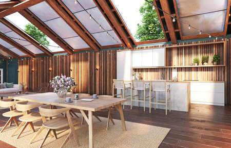An open kitchen and dining area with wooden beams and string lights. 3d renderingの写真素材