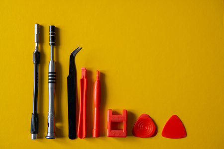 Set of tools on a yellow background.