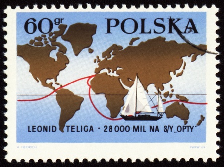 POLAND - CIRCA 1969: stamp printed in Poland, shows map with route of world tour of polish yachtsman Leonid Teliga, circa 1969の写真素材
