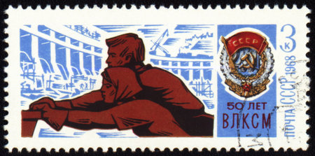 USSR - CIRCA 1968: A stamp printed in USSR, shows young workers push trolley and Order of the Red...