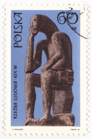 POLAND - CIRCA 1969  a stamp printed in Poland, shows statue of seated man, series  Folk sculpture , circa 1969のeditorial素材