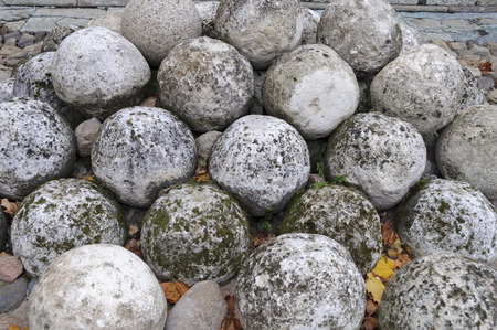 Stone cannonballs in Kremlin of ancient russian city Veliky Novgorodの写真素材