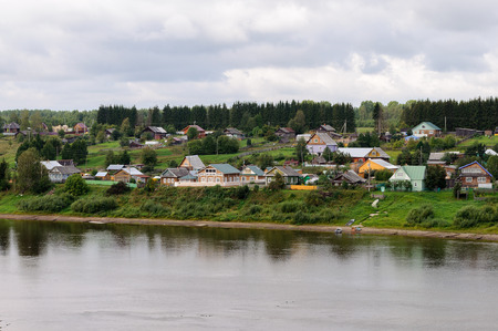 Village on the bank of Sukhona river near Totma town, Northern Russiaの写真素材