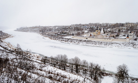 View of the frozen Volga River and the ancient russian town Staritsa with the Holy Assumption Monastery on riverbankの写真素材