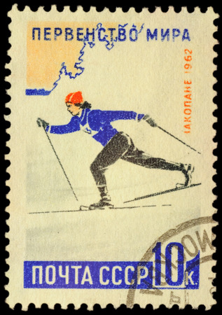 USSR - CIRCA 1962: stamp printed in USSR shows running woman skier, devoted to the World Ski Championships 1962 in Zakopane, series, circa 1962のeditorial素材