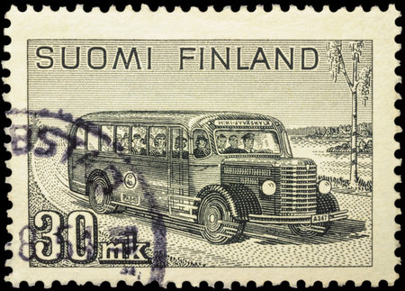 MOSCOW, RUSSIA - FEBRUARY 10, 2016: A stamp printed in Finland shows retro postal bus with passengers on rural road, series "Mail Van", circa 1946のeditorial素材