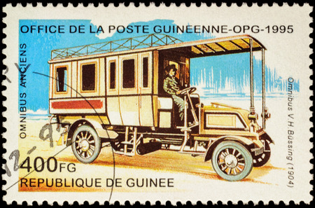 MOSCOW, RUSSIA - FEBRUARY 10, 2016: A stamp printed in Guinee shows old omnibus Bussing (1904), series "Veteran Omnibuses", circa 1995のeditorial素材